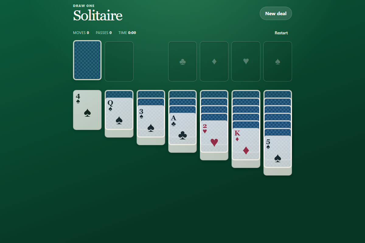 A game of Klondike Solitaire on a green card table